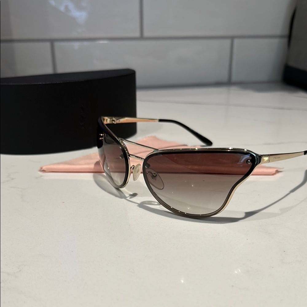 Prada Gold Aviator Sunglasses with Gradient Lenses